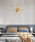 Gold Sputnik Chandelier With Six Lights, Vintage Geometric Pendant Fixture above bed in stylish bedroom setting.
