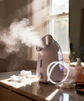 Silicone Steamer Tube 39 Inch Heat Resistant Steam Hose for Home Sauna shown next to steaming facial steamer.