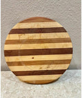 Vintage Handmade Multiwood Lazy Susan Charcuterie Board And Revolving Table Tray with striped design on textured background.