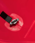 Close-up of Red Ergonomic Hand Spreader with built in armrest, showing sealed gearbox and trigger in lightweight poly construction.