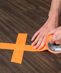 Neon Orange Duct Tape 1.88 Inches Wide By 15 Yards Long Single Roll Tearable By Hand Great For Quick Fixes Repairs And Crafts Sticks To Cloth Vinyl Leather And Uneven Surfaces being applied to wood surface
