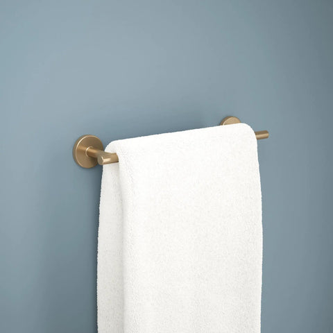 Champagne Bronze 12 Inch Towel Bar For Bathroom And Kitchen With Corrosion Resistant Finish Rustproof Towel Holder That Promotes Airflow For Faster Drying And Adds Modern Decorative Touch displaying a white towel against a blue wall.