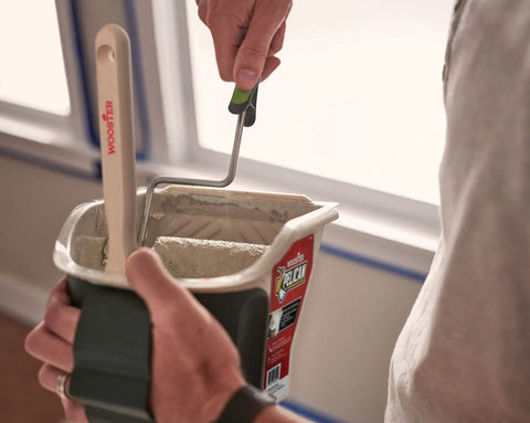Hand Held 1 Quart Paint Pail With Built In Five And One Half Inch Roll Off Area And Ledge To Catch Excess Paint Magnetic Brush Holder For Quick Cleanups Rust Resistant Integrated Design That Will Not Trap Paint Secure Strap For Easy Haul On The Go