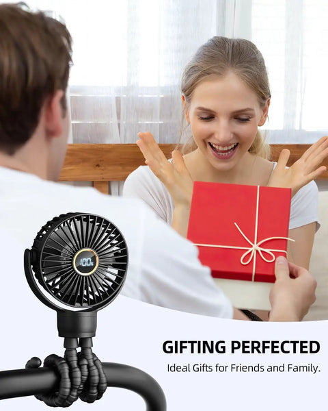 Couple exchanging gift with Portable Stroller Mini Fan visible on a flexible tripod clip, black, with rotatable head