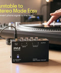 Pyle Phono Turntable Preamp Mini Electronic Audio Stereo Phonograph Preamplifier With 9V Battery Compartment, connecting to a turntable.