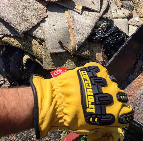 Mens 360 Degree Cut Resistant Level 5 Leather Work Glove With Impact Protection Goatskin Construction TPR Finger Knuckle Guards Kevlar Threading Yellow Extra Large in use during trash removal.