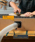 Universal Dust Port Two and a Half Inch OD Connector Flange installed on woodworking machine with hose attached