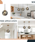 Brass Gold Globe Pendant Light Lit With Smoke Gray Glass Shade Mid Century Modern Ceiling Hanging Fixture in kitchen and dining