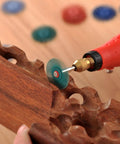 140 Piece Polishing Kit for Rotary Tools With One Eighth Inch Shank used on carved wood surface