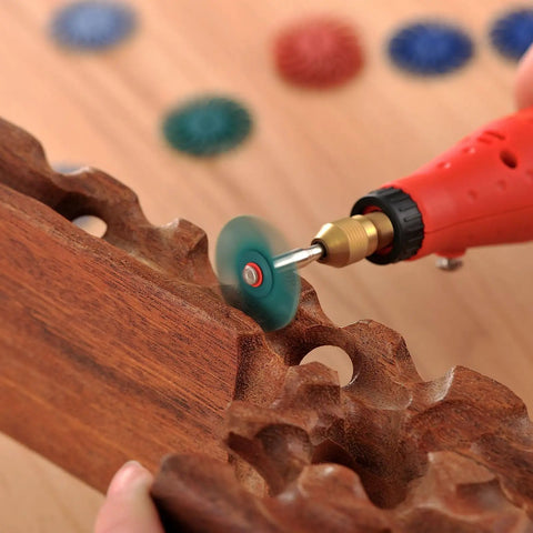 140 Piece Polishing Kit for Rotary Tools With One Eighth Inch Shank used on carved wood surface