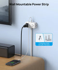 Compact 360 Rotating Flat Plug Power Strip With 5 Foot Cord, Four Widely Spaced Outlets, Heavy Duty Surge Guard mounted on wall.
