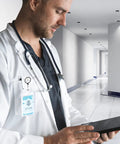 Doctor using a tablet in a hospital corridor