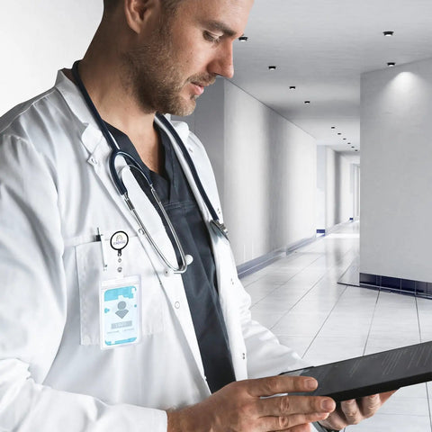 Doctor using a tablet in a hospital corridor