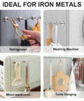 Heavy Duty Magnetic Hooks With Neodymium Magnets For Tool Free No Drill Hanging In Kitchen Office Classroom Garage Cruise Ship And More Movable Reusable Hangers 12 Pack mounted on refrigerator, washing machine, microwave, and tool rack