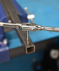 Close-up of One Eighth To Twenty Seven NPT And Twenty One Sixty Four Combo Pipe Thread Tap in use for cutting threads
