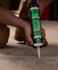 Person applying Gray Concrete Sealant For Driveways, Steps, And Sidewalks, All Weather Tough As Nails Hybrid Polymer Sealant, 9 Oz