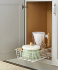 Top Shelf Pull Out Cabinet Organizer, Heavy Duty Pantry Drawer Rack For Kitchen Laundry Room, Rock Solid Slide Out Storage Rack For Pots Towels And Cleaning Supplies, Clean White with pots and kitchen tools visible.