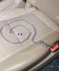 Badass Stainless Steel Dog Car Seatbelt No Chew Pet Safety Restraint Cable on car seat, heavy-duty and durable design.