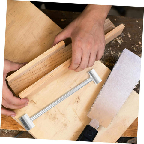 Person using the adjustable hinge wrench dual spanner tool for easy hinge adjustments, with a saw and wood on a workbench.