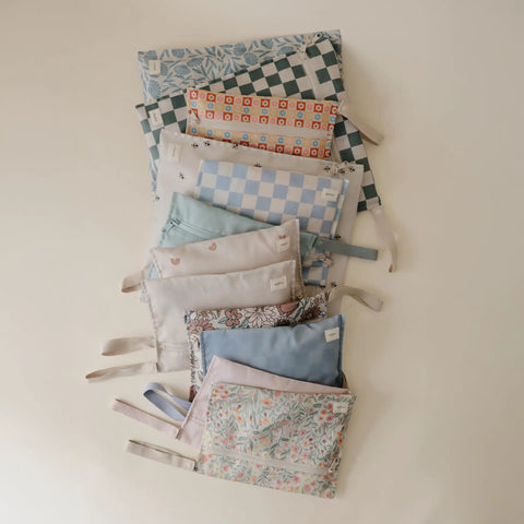 Assorted designs of water resistant wet bags set of 2 for baby gear and travel on the go large and small reusable storage pouches.