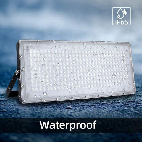 JUDYSSY 6 Pack Led Flood Light Outdoor, 300W Work Light with IP65 waterproof rating and droplets on surface.