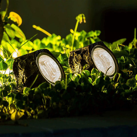 Solar Powered Rock Lights Outdoor Dope 2 Pack With 10 LED Waterproof Stones illuminating garden path at night