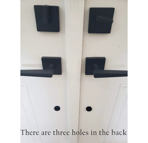 Oil rubbed bronze door handle set with keyed and dummy handles on a white door.