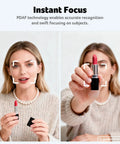 Woman showcasing lipstick with PDAF focus technology, wearing a pearl necklace, in a cozy sweater.
