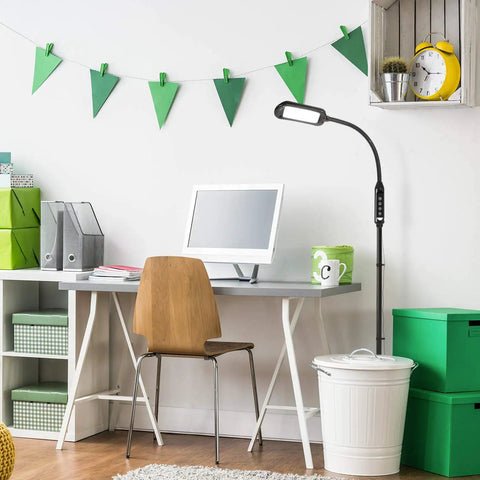 2 In 1 LED Floor And Desk Lamp With Adjustable Height And Gooseneck next to a desk in a dorm room, ideal for reading and study tasks.
