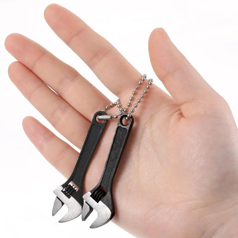 Two Pack 2.5 Inch Mini Adjustable Crescent Wrenches With Locking Keychain held in hand, compact carbon steel repair tools