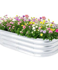 Outdoor Raised Garden Bed Kit, Galvanized Oval Metal Planter Box 120cm L X 60cm W X 30.5cm H filled with colorful flowers