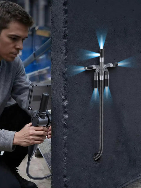 Person using Two Way Articulating Borescope Endoscope Camera With Light Dual Lens 1080P Industrial Inspection Tool on concrete wall