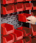 Level Up Your Shop Setup With This Heavy Duty Storage Cabinet Featuring Full Swing Roll Back Doors And 72 Bright Red Plastic Bins, individual red bin being accessed.