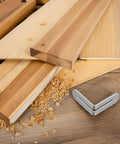 Stainless Steel L Shape Shelf Brackets for wood shelves with adjustable slot design next to wood shavings and planks, angled view.