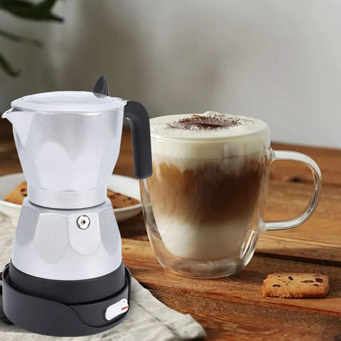 Electric Moka Pot 3 Cup Aluminum Coffee Maker With Detachable Base, Portable Italian Cuban Style Mocha Pot next to coffee cup