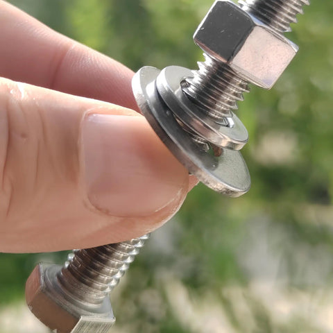Close-up of Four-Set 3/8-16 x 4 stainless steel hex head bolts with nuts, flat and lock washers, 18-8 304 stainless material.