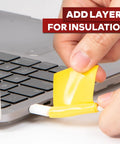 Applying Go To Self Fusing Silicone Tape Pro Yellow 1.5 Inch By 15 Feet Thick 30 Mil to a laptop cable for insulation.