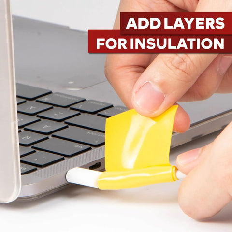 Applying Go To Self Fusing Silicone Tape Pro Yellow 1.5 Inch By 15 Feet Thick 30 Mil to a laptop cable for insulation.