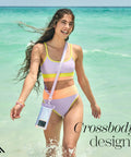 Woman at beach with IP68 Waterproof Phone Pouch With Floating Lock Seal In Iridescent Soap Bubble Finish, worn crossbody