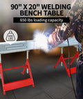 Heavy Duty Steel Welding Workbench Rig With Adjustable Height And Angle Foldable Shop Station showing 90x20 inch table with welding in action.