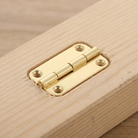 12 Pack Small Antique Gold Iron Hinges With Rounded Corners mounted on wooden surface