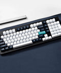 Compact 96 Percent Wireless Mechanical Keyboard Hot Swap Switches in white and navy on a dark surface.