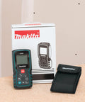 Pro Grade Laser Distance Meter With 262 Foot Range And Precision, Measures To 1/16 Inch, Great For DIY Projects next to packaging