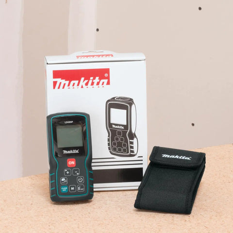 Pro Grade Laser Distance Meter With 262 Foot Range And Precision, Measures To 1/16 Inch, Great For DIY Projects next to packaging