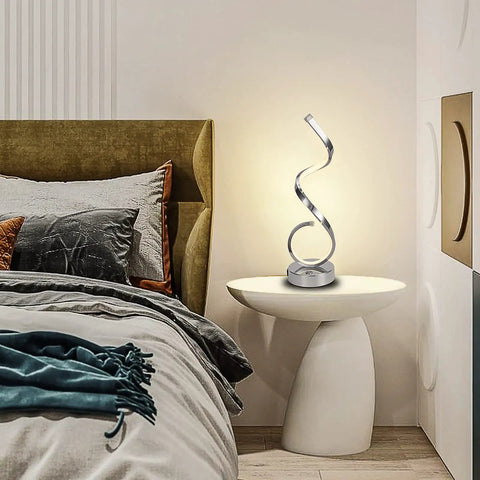 Modern Spiral LED Table Lamp with Dimmable Touch Control and USB Port 22W Reading Light on bedroom nightstand, lit, curved design.