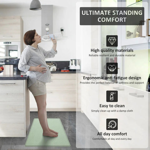Woman standing on Comfy Anti Fatigue Kitchen Mats Set Of 2 For Standing Long Hours Washable Floor Rugs 17x29 And 17x59 Light Green Non Slip Design Durable Memory Foam Feel Easy To Clean Perfect For Cooking And Daily Chores