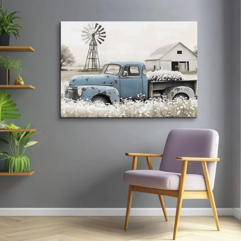 Rustic Countryside Barn Canvas Wall Art Featuring Blue Rusty Old Pickup Truck, White Flower Meadow, Windmill and Barn Backdrop For Farmhouse Decor, Vintage Country Vibe Print, 24x16 Inches on a Wall