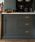 Dark kitchen cabinets with 10 Pack Antique Brass Cup Pulls For Kitchen Cabinets And Furniture, 3 Inch Hole Center Drawer Pulls installed.