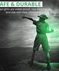Person holding a glowing Military Grade Glow Sticks Green 6 Inch Emergency Light Stick on a cliff at night.