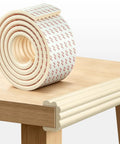 Game Changing Baby Edge Protectors And Corner Guards Super Wide High Density Foam Furniture Bumper Shields displayed on a table.
